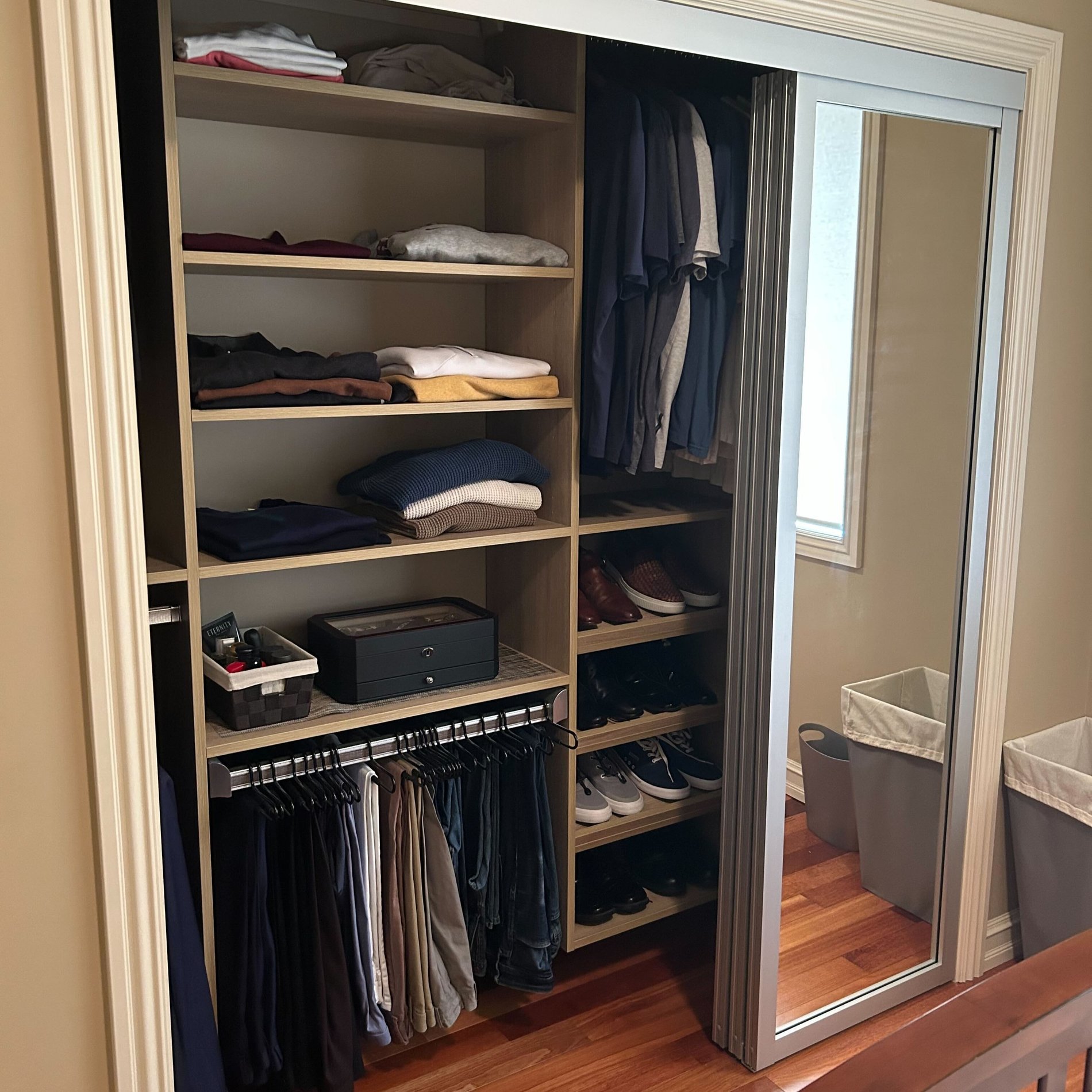 Reach in Primary Closet reach in closet with sliding glass doors