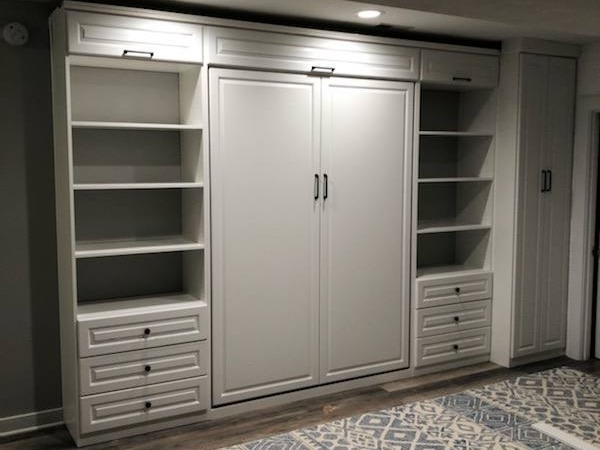Custom Walk-In Closet Richmond - Custom closets - Closed Murphy bed unit with bookshelves on each side