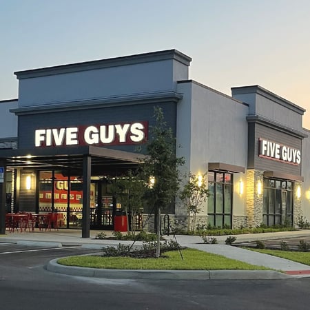 Exterior photograph of the brand-new Five Guys restaurant located at 860 US Highway 70 in Clermont, Florida.