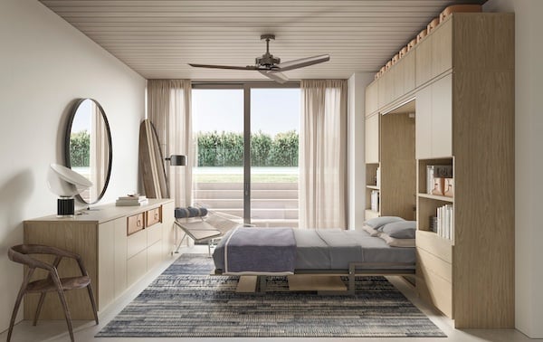 More Than a Guest Room Murphy bed with custom built-in cabinetry, shelving and storage in a modern multipurpose guest room. California Closets, Greater Detroit