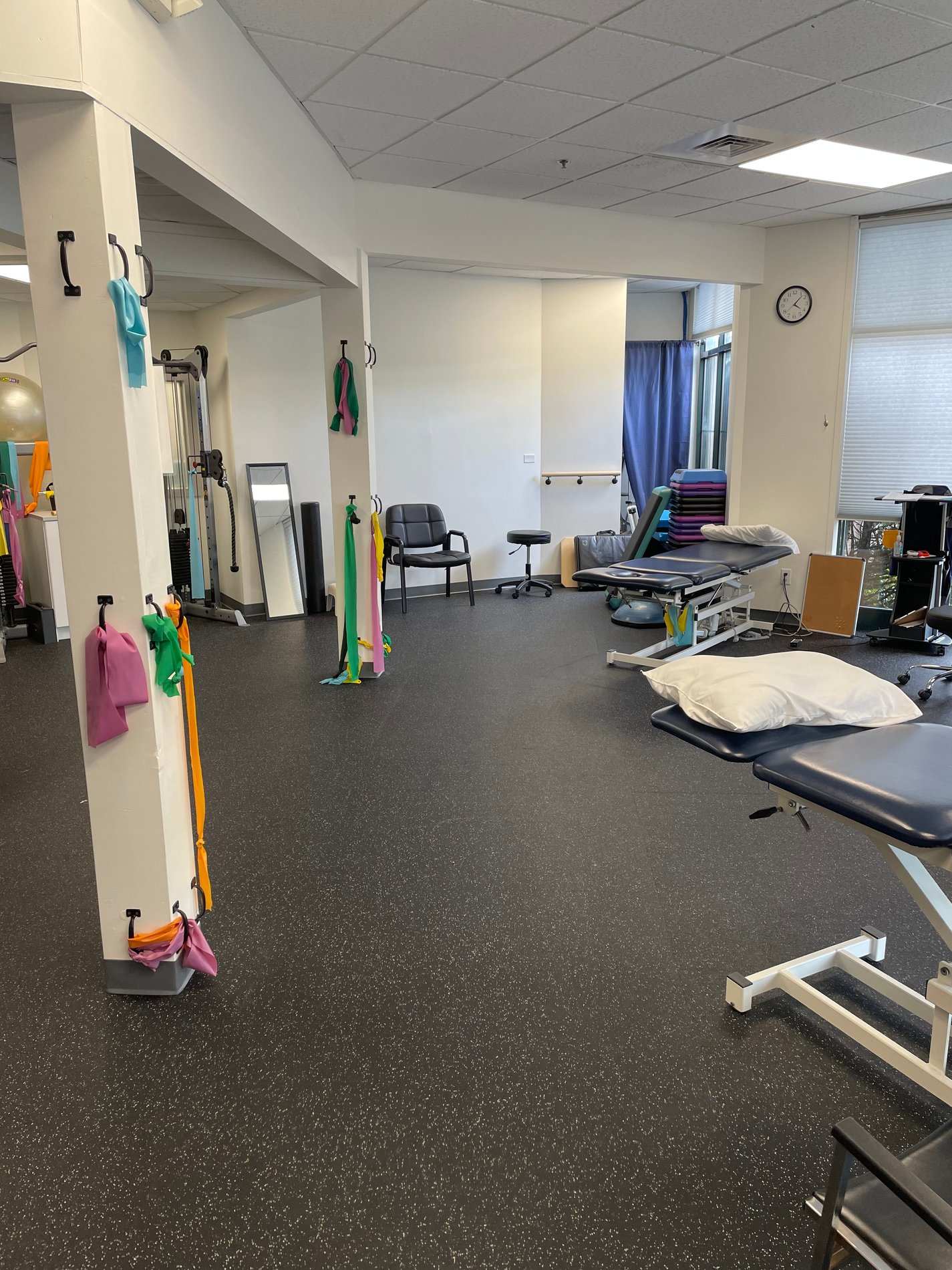 Bay State Physical Therapy Kingston MA Patient care area showing PT Tables and equipment.