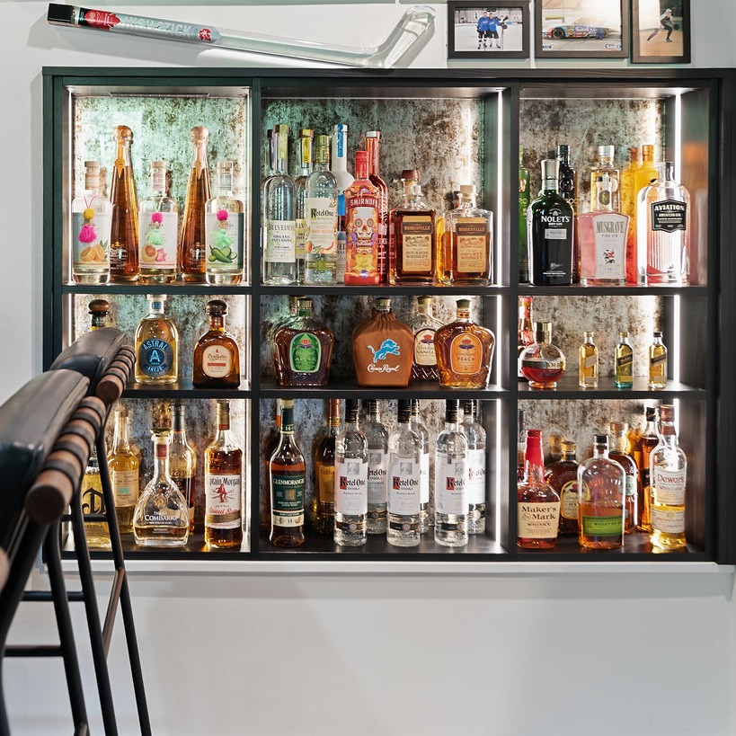 Bar space for every party! Bar Shelves with acid wash reflective backer and shelves by California Closets Northern Michigan