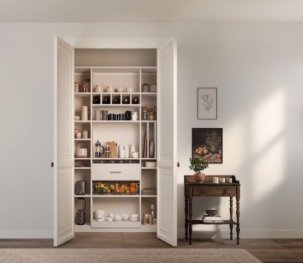 A Pantry Made for Everyday Kitchen pantry cabinets with custom shelving, pull-out storage and organized space for food, dishes and small appliances. California Closets, Greater Detroit