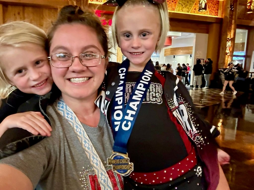Everest winning a cheerleading championship with NAC