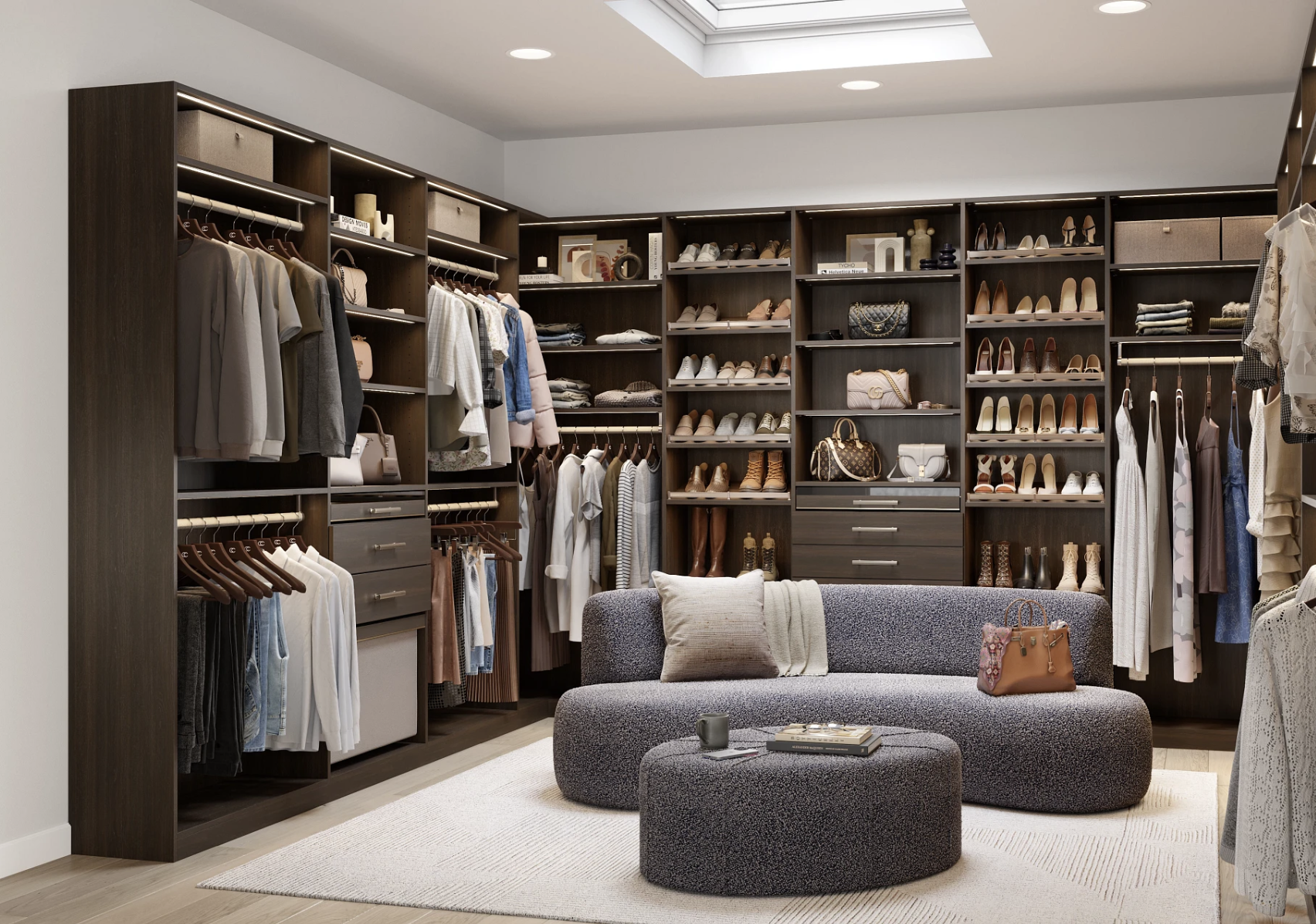 Luxury Custom Walk-In Closet with Adjustable Shelving, Shoe Storage, and Lighting | California Closets Austin Custom walk-in closet design by California Closets Austin, featuring adjustable shelving, ample shoe storage, drawers, integrated lighting, and a luxurious dark woodgrain finish.