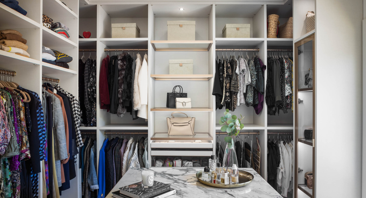 Luxury White Walk-in Closet Img 9 -California Closets Westchester County New York Full Room Walk-in Closet Marbel Center Island Double Hanging Middle Vanity with Everstyle Gold Jewelry Drawers and Shelving