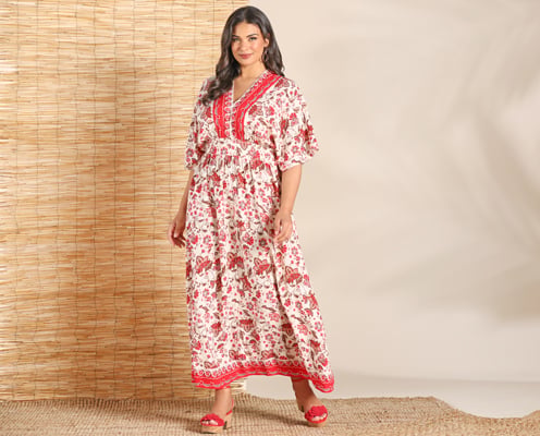 Woman is wearing a red plus size maxi dress.