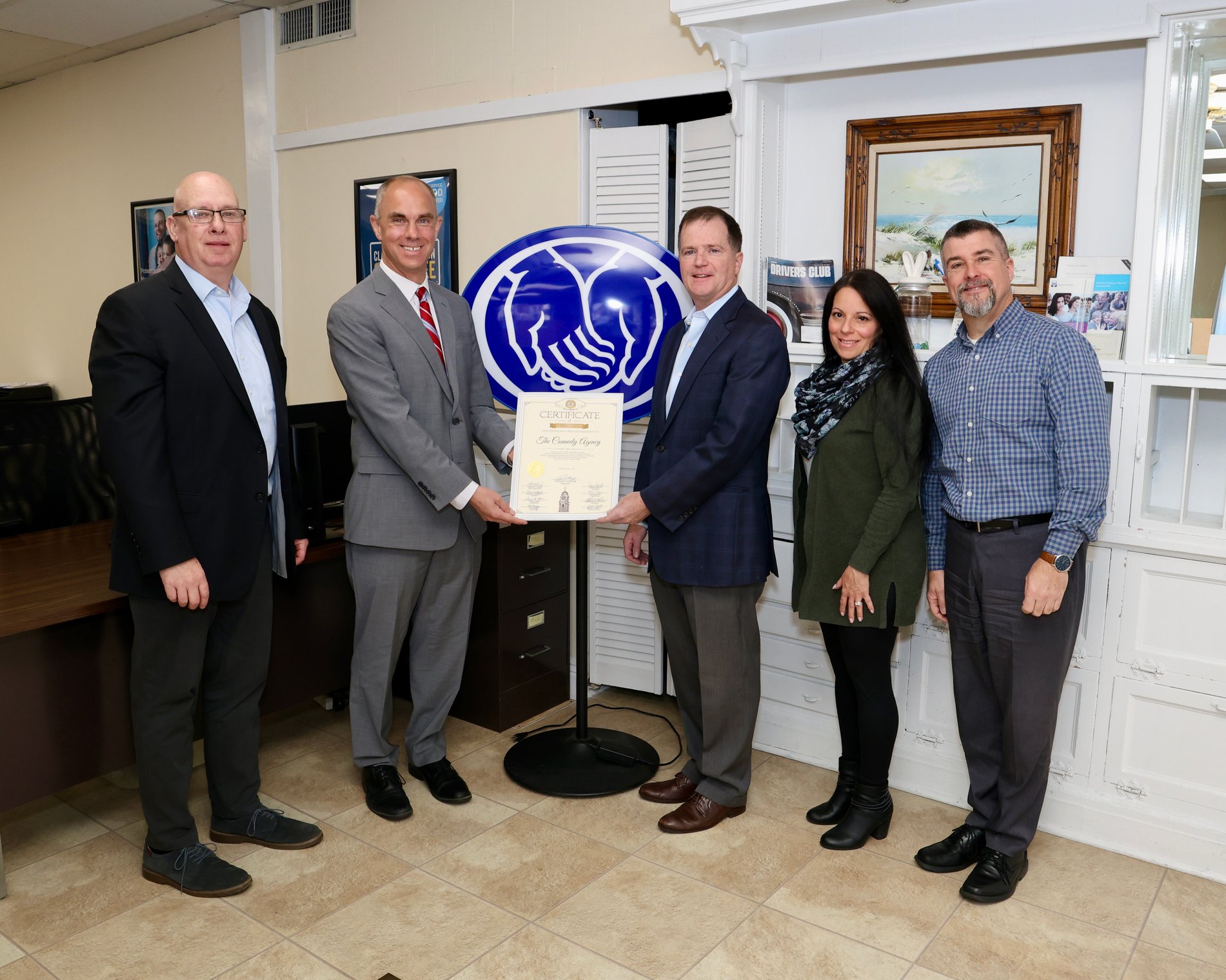 Hempstead Town Councilman Chris Schneider Presenting The Conneely Agency with the Small Business Spotlight for their work in the local community.