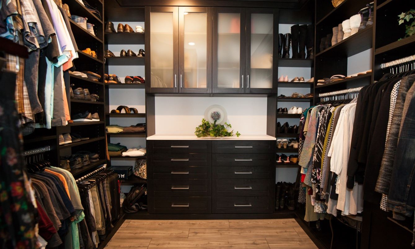Design Consultant | Debbie Gabbard Custom His and Her Closet with Frosted Glass Doors, Shoe Shelves, and Pant Racks in Rehoboth Beach, Delaware by California Closets of Philadelphia and Delaware