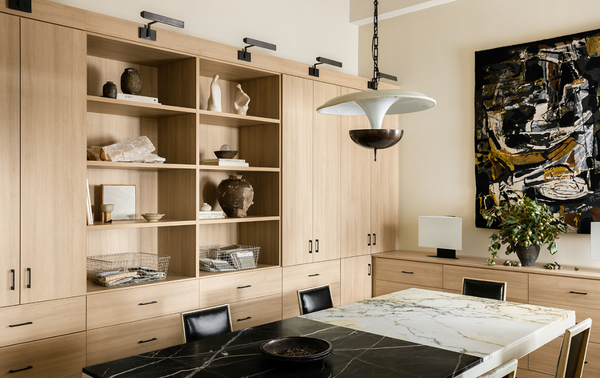 Modern Conference Room natural wood conference room with bookcase shelving, closed cabinetry and a meeting table at the center
