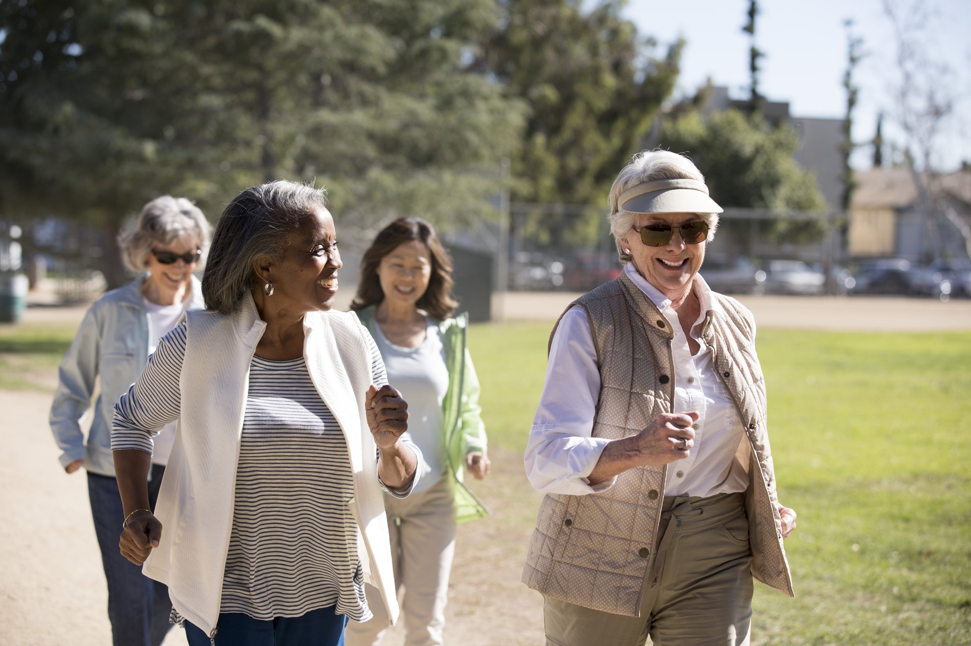Senior women walking on sunny day