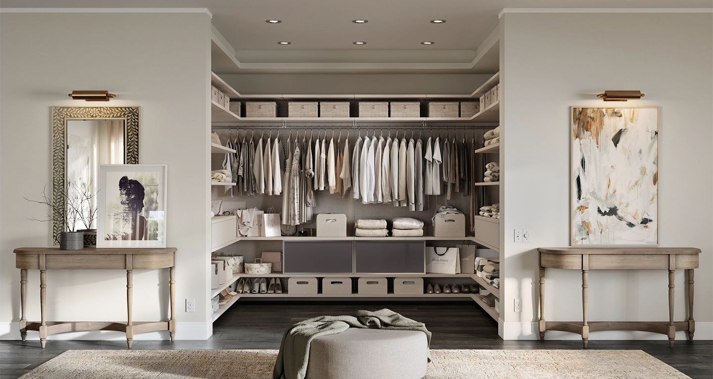 Luxury walk-in closet with shelves and hanging system designed by California Closets. Walk-in closet with shelves and hanging system