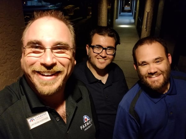 Photo of agent and 2 other guys smiling