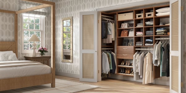 Custom reach-in closet with built-in shelving, drawers, and organized hanging space inside a bedroom by California Closets Memphis, Tennessee.
