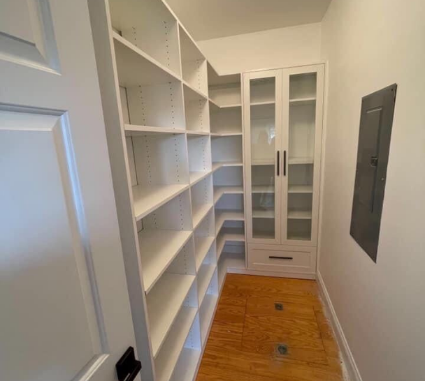Walk-In Closet With Shelving Walk-in closet with walls of shelving.