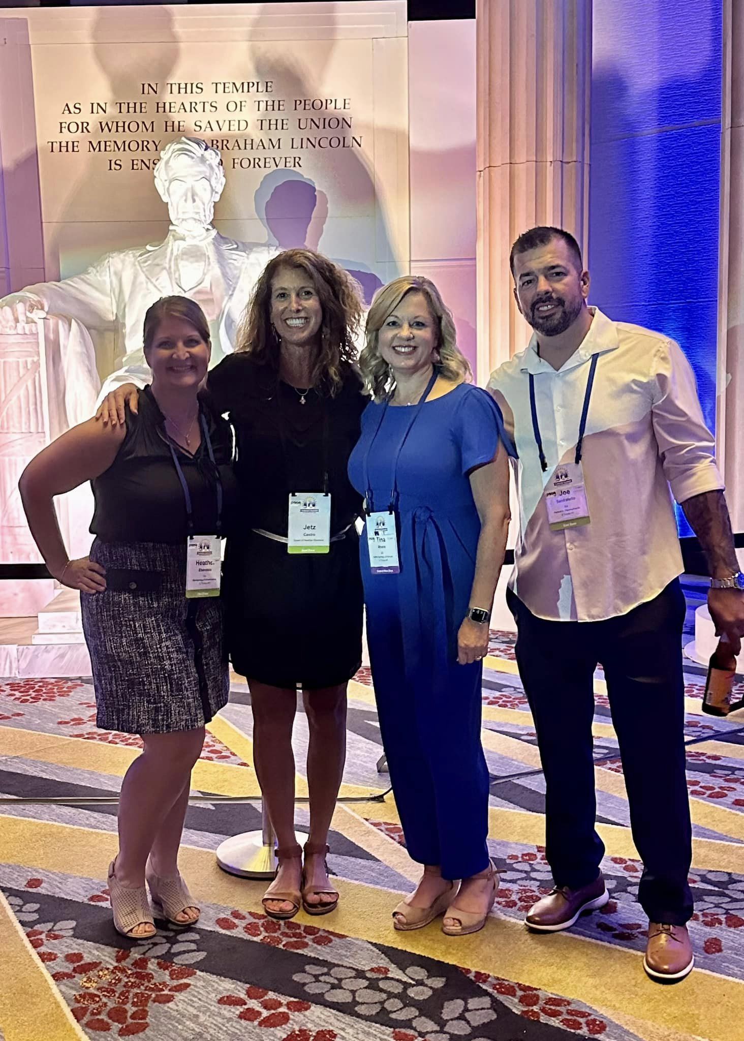 Christine Angles, from Northern Virginia, meets with Allstate insurance agents from around the country