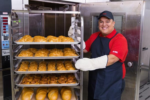 Bakery employee making bread