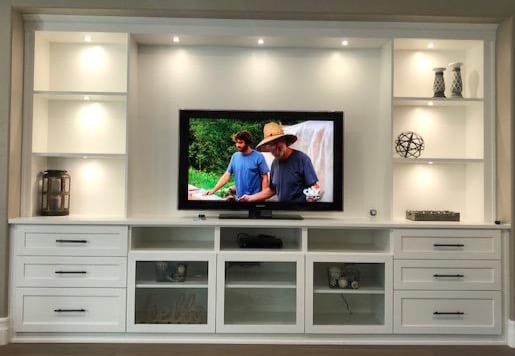 Traditional white media center Custom designed white traditional entertainment center with lighting