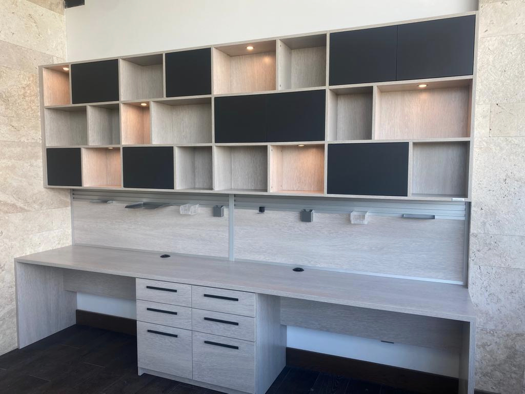 Custom office Custom built desk for two side by side with cabinets and cubbies above