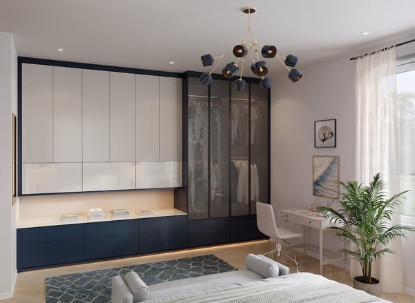 Wardrobe with custom cabinetry, glass-front closet storage, integrated lighting and built-in drawers in a modern bedroom.