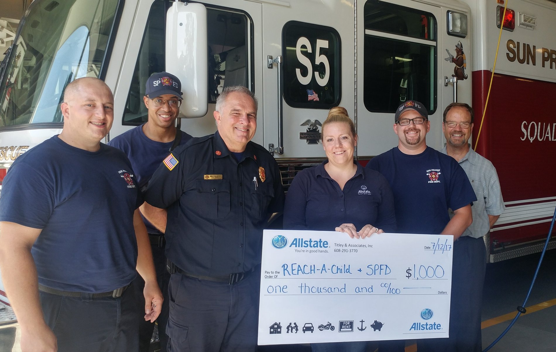 $1,000 grant presented to Reach-A-Child and the Sun Prairie Fire Department