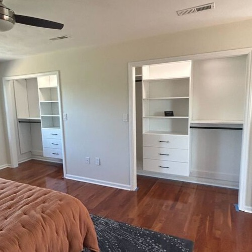 Tan closet shelving with organized clothes and accessories Greensboro - Custom closets - two open concept bedroom closets with built-in floating shelves and drawers