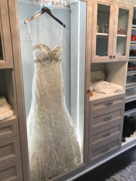 Luxe Walk In Closet A luxury walk in closet with wedding dress storage and drawers on each side.