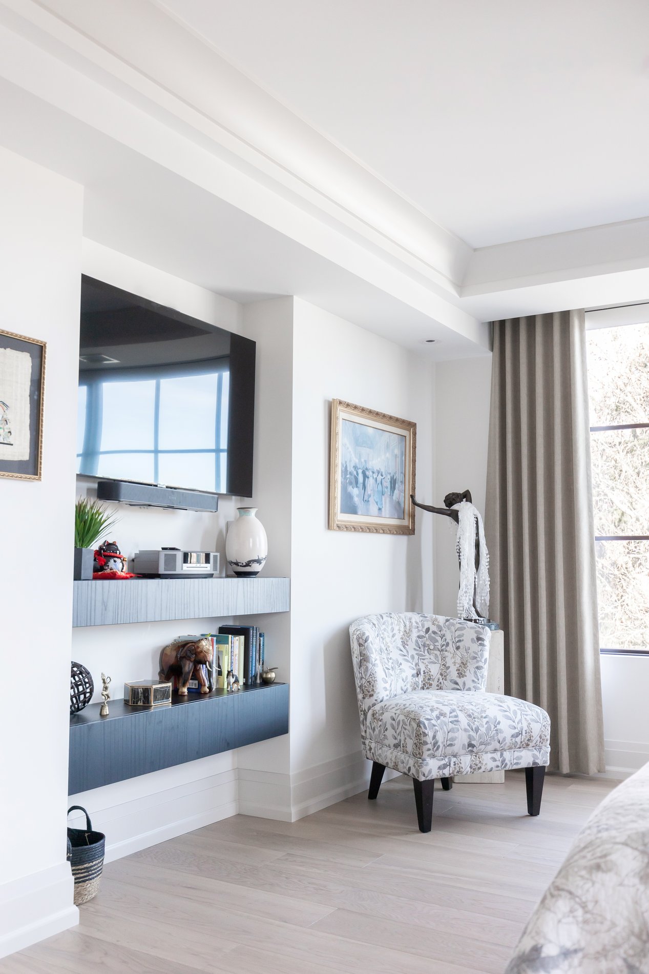 Luxe black storage cabinets that double as shelves and offer the perfect addition for your bedroom television