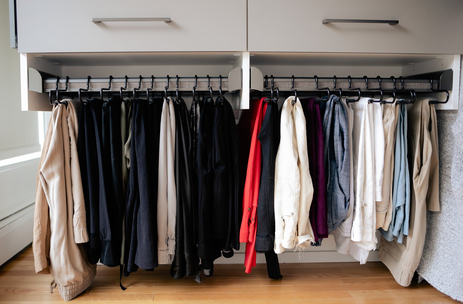 Walk-in closet with pull-out hangers Pull out hanger rack for pants, shorts and other bottoms