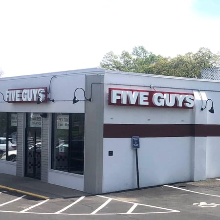 Exterior photograph of the Five Guys restaurant at 534 Post Road East in Westport, Connecticut.