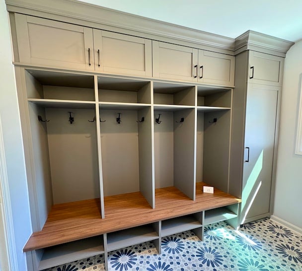 Custom Family Mudroom Custom mudroom storage with built-in bench, coat hooks, and upper cubbies.