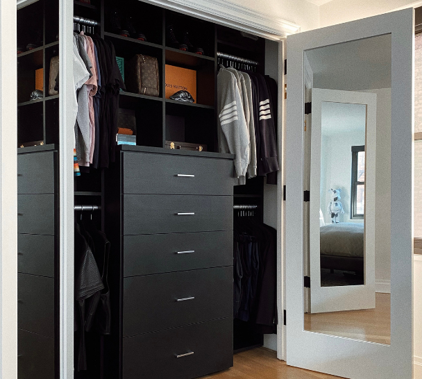 Black Reach-in Closet black reach-in closet with drawers, shelving and hanging space Manhattan New York