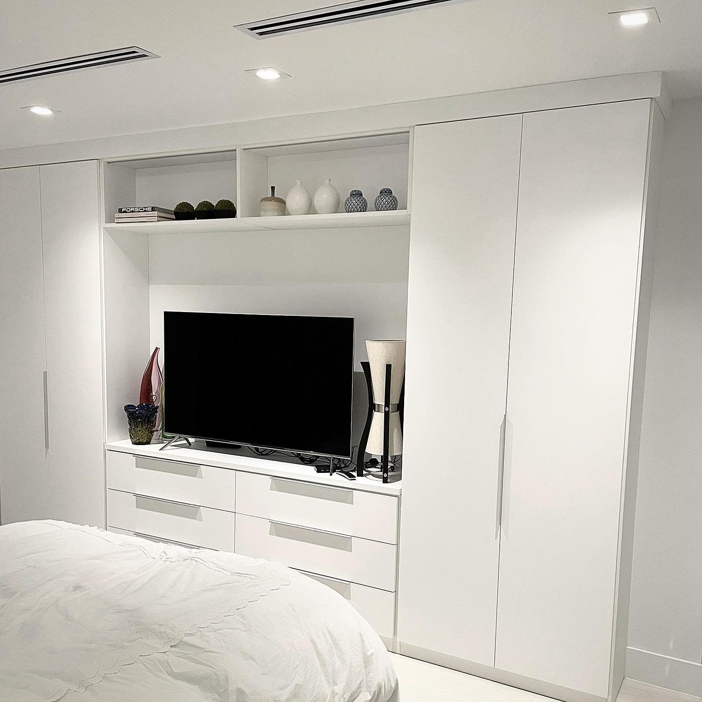 Custom Wardrobe and media unit White wardrobe with drawers and entertainment center