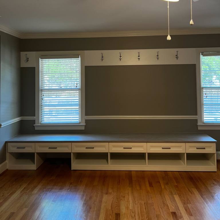 Built-In Cubbies, Drawers, and Hooks Combo Built-in cubbies and drawers along the bottom with hooks installed along the top.