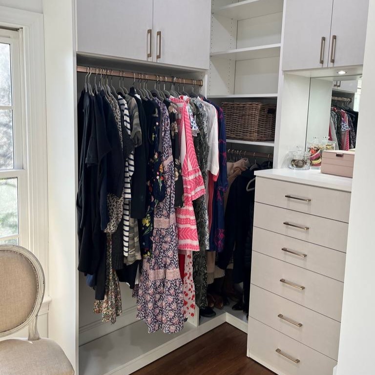 Built-In Dresser and Cabinetry Inside Walk-In Closet Built-in dresser drawers and cabinets inside a walk-in closet.