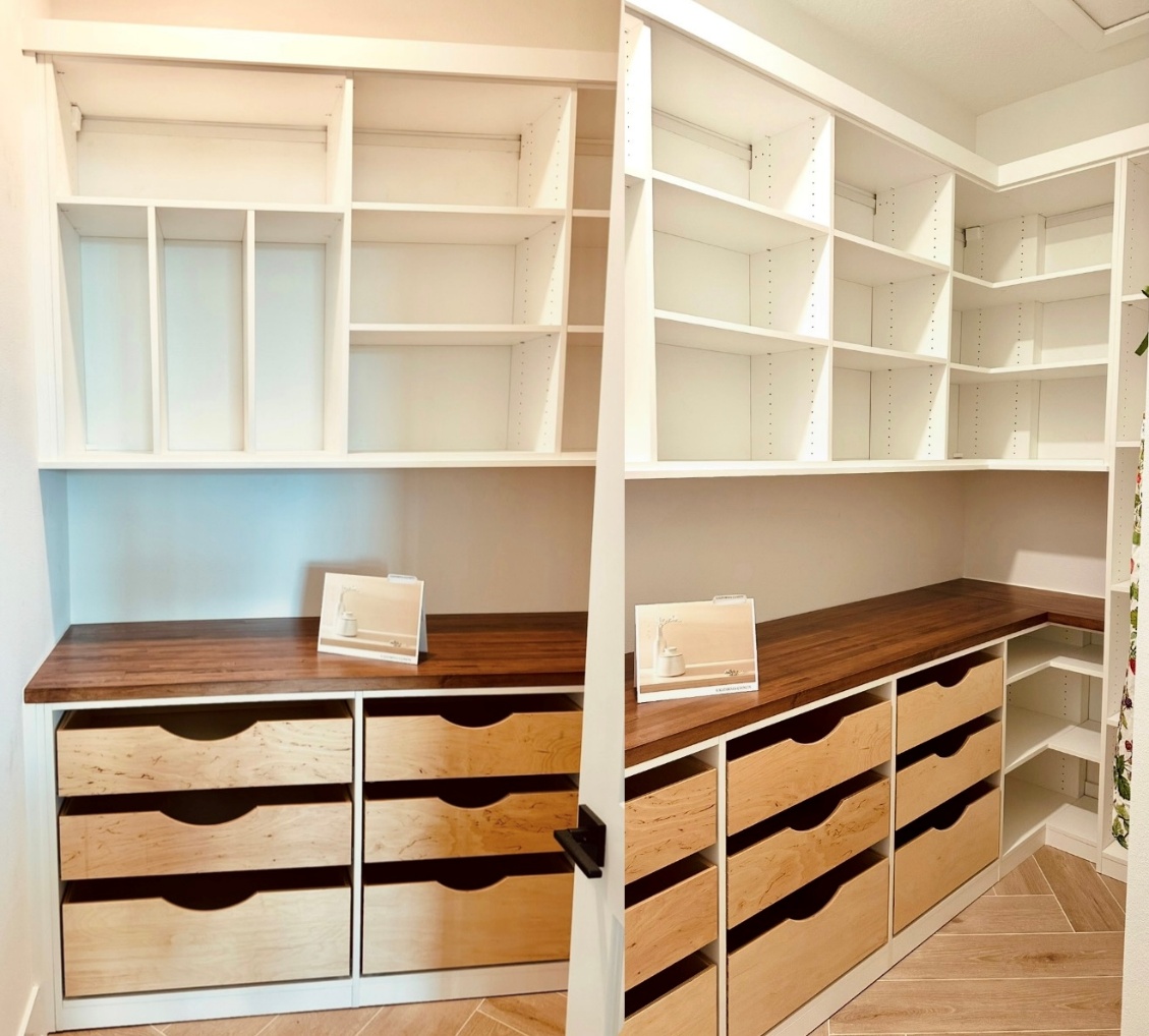 Clean & Functional Pantry Custom pantry in dove white with butcher block faceless drawers.