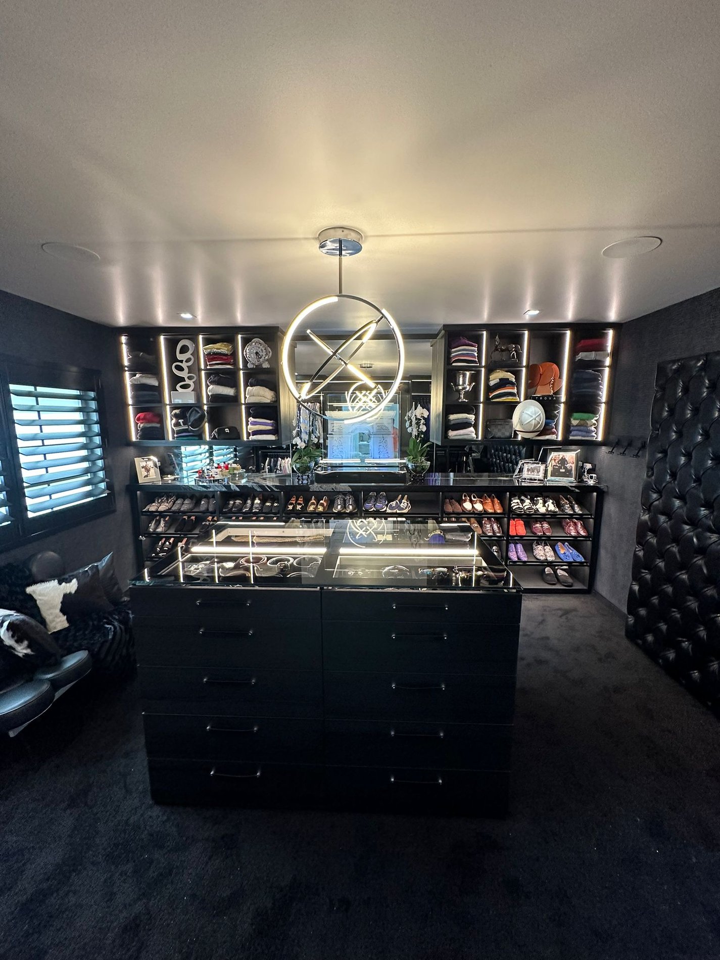 Dark Wood Walk In Closet with Glass Top Island Custom Walk in Closet in Shadow with Lighting and a Glass Top Island