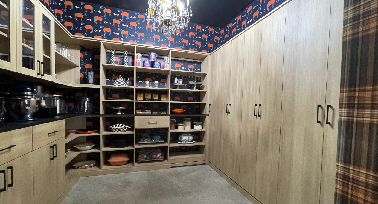 Full Room Pantry Img 9 - California Closets Hudson Valley New York Natural Wood Pantry with custom shelving to hold pots, pans, canned goods and spices and closed cabinet doors to hold kitchenware and cleaning supplies