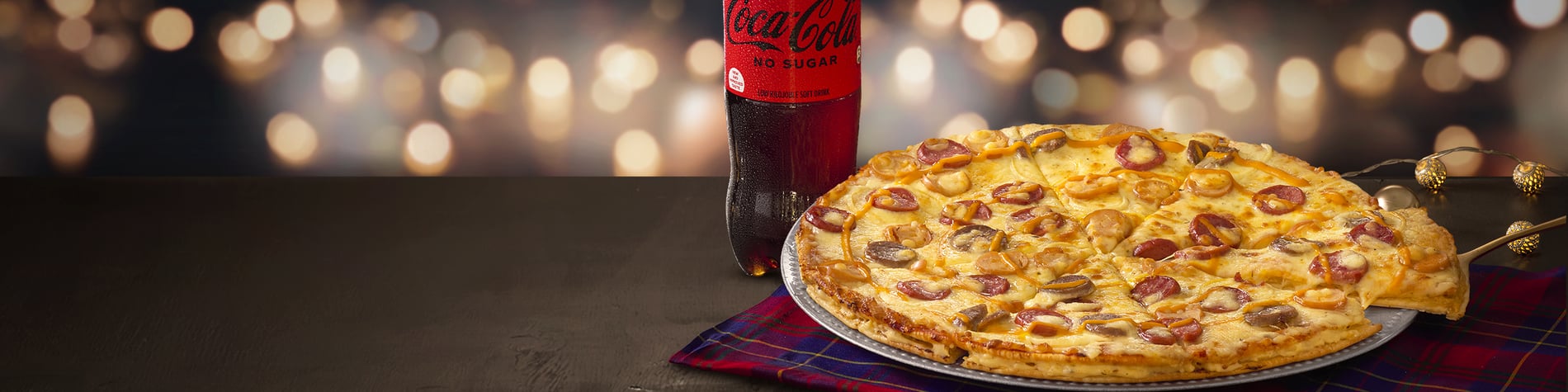 5-Sausage Double-Stack® Feast – festive pizza special with a large 5-Sausage Double-Stack® pizza, 2 sides and 2 FREE small margherita pizzas from Debonairs Pizza