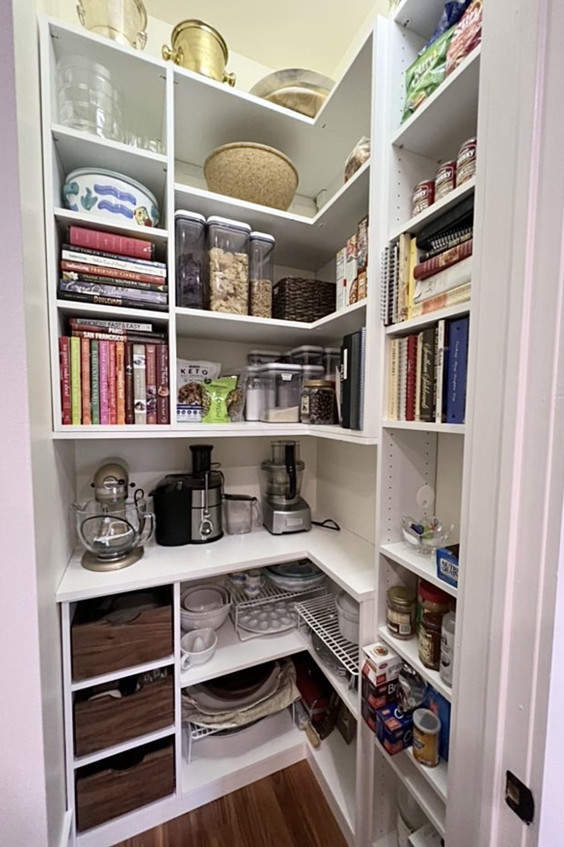 Reach-in Pantry Custom closet shelving for a pantry with cabinets by California Closets Baldwin County & Mobile, Alabama.