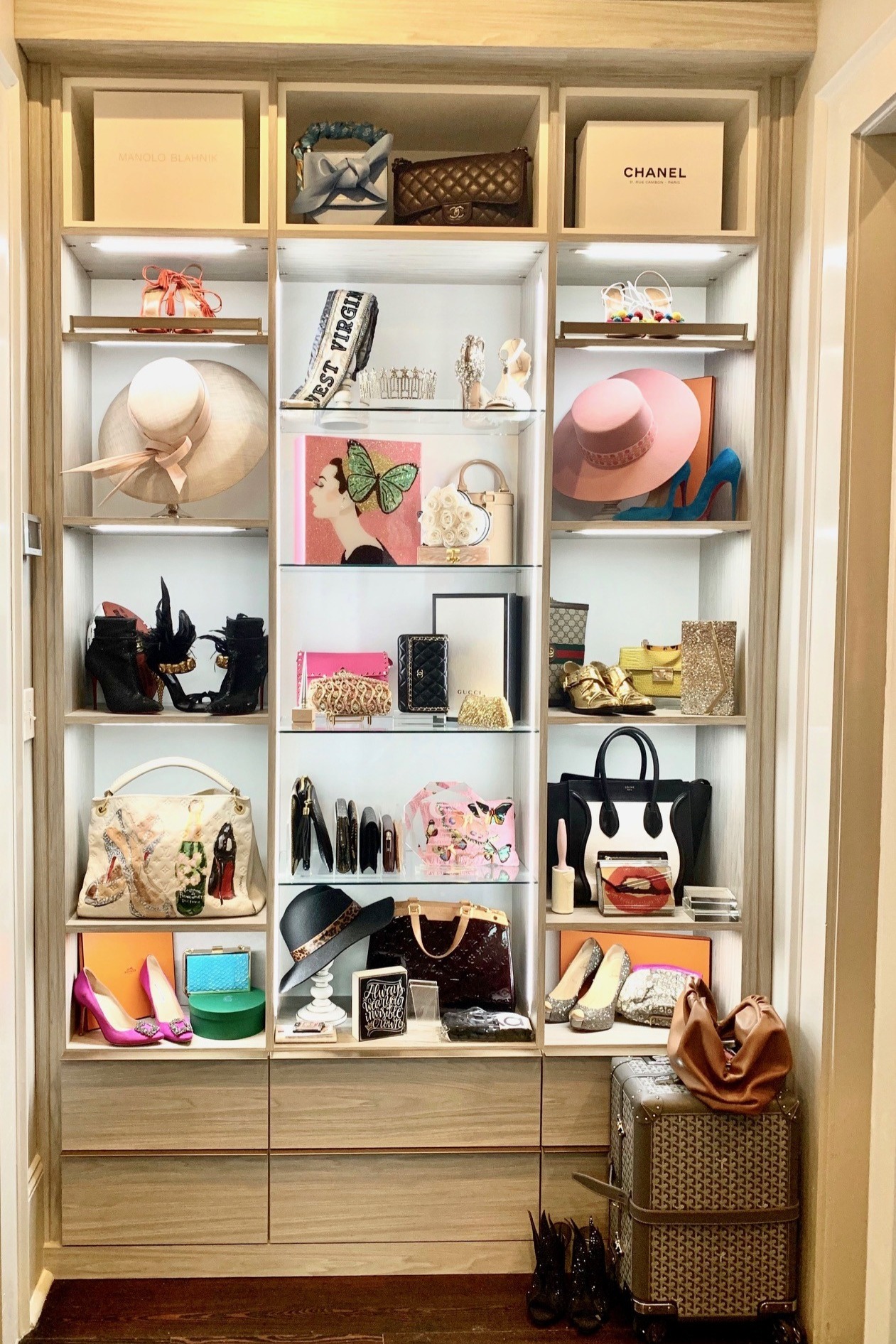 Display Shelving Reach in closet organization with glass shelving and lights for closets California Closets Gulf Coast & New Orleans