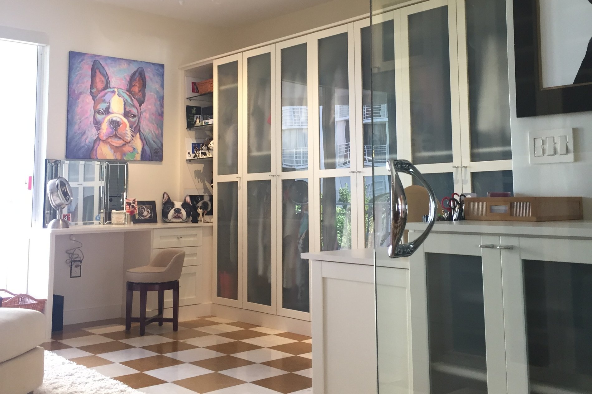 Chic and Functional Dressing Room with Frosted Glass and Chrome Details DRESSING ROOM with FROSTED GLASS, MULLION CHROME END PANEL with a VANITY and GLASS SHELVES with SHAKER APPLIED BASE