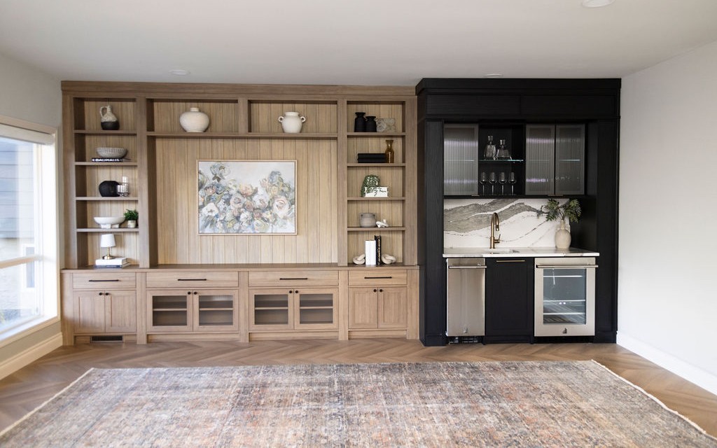 Luxe Entertainment System Entertainment centre with a bar and media section. Each area is defined in a specific finish but seamlessly bends to one cohesive design.