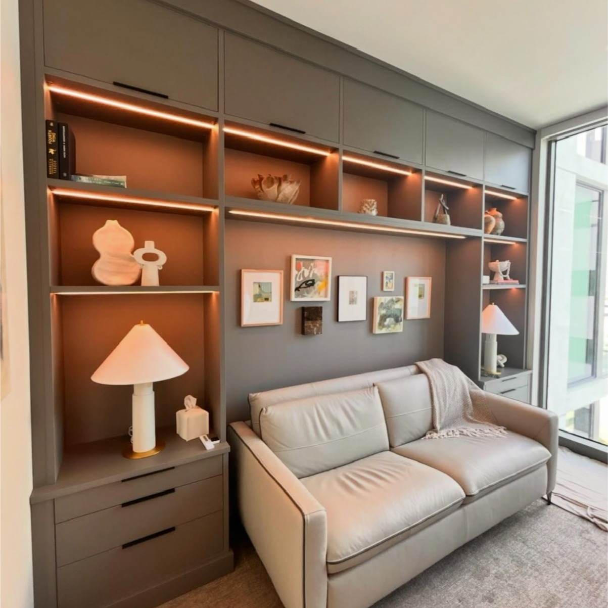 Modern Closet with Shipshaw Finish and Sleek Black Accents Closet with Shipshaw finish, black hardware accents, and integrated LED strip lighting.