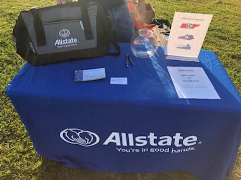 Table set up with cooler to give away and other raffle items.
