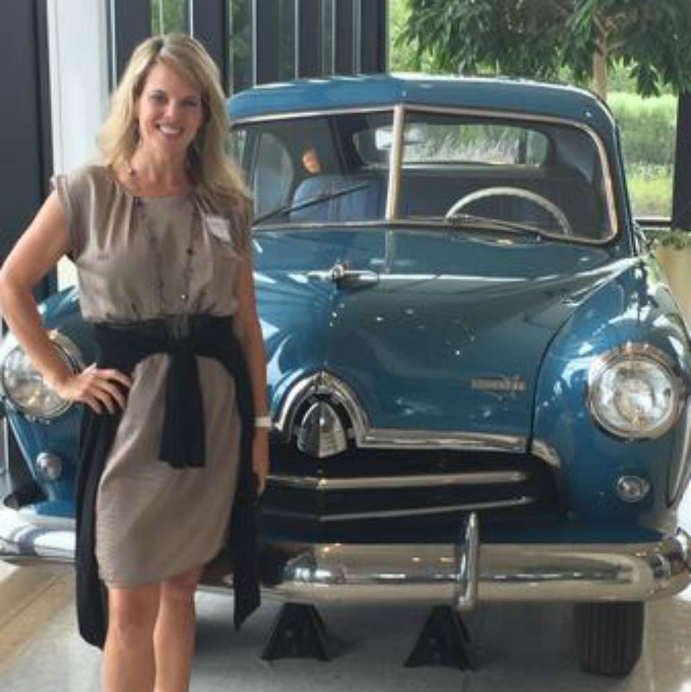 Al Allstate home Office in Northbrook with the first car Allstate ever insured.