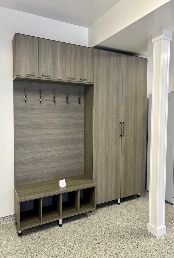 Custom Garage Storage Garage storage system with custom storage, built-in cabinets, bench seating, and cubbies for home organization