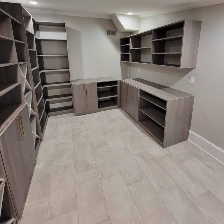Walk-In Closet Solution In Use Greensboro - Custom closets - Wrap-around shelving unit that spans across three walls