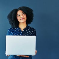 woman looks up as she thinks about refinancing her home