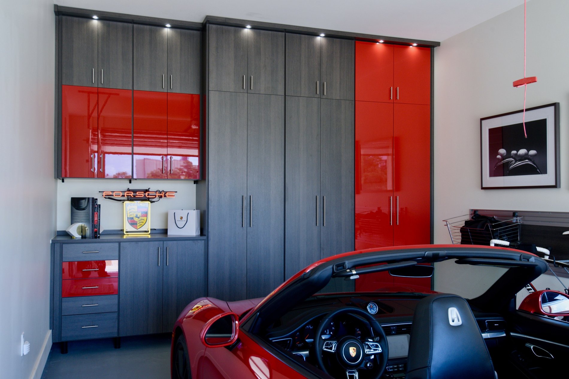 Garage Storage Cabinets Red and gray storage in garage with custom cabinets for garage storage California Closets Gulf Coast & New Orleans
